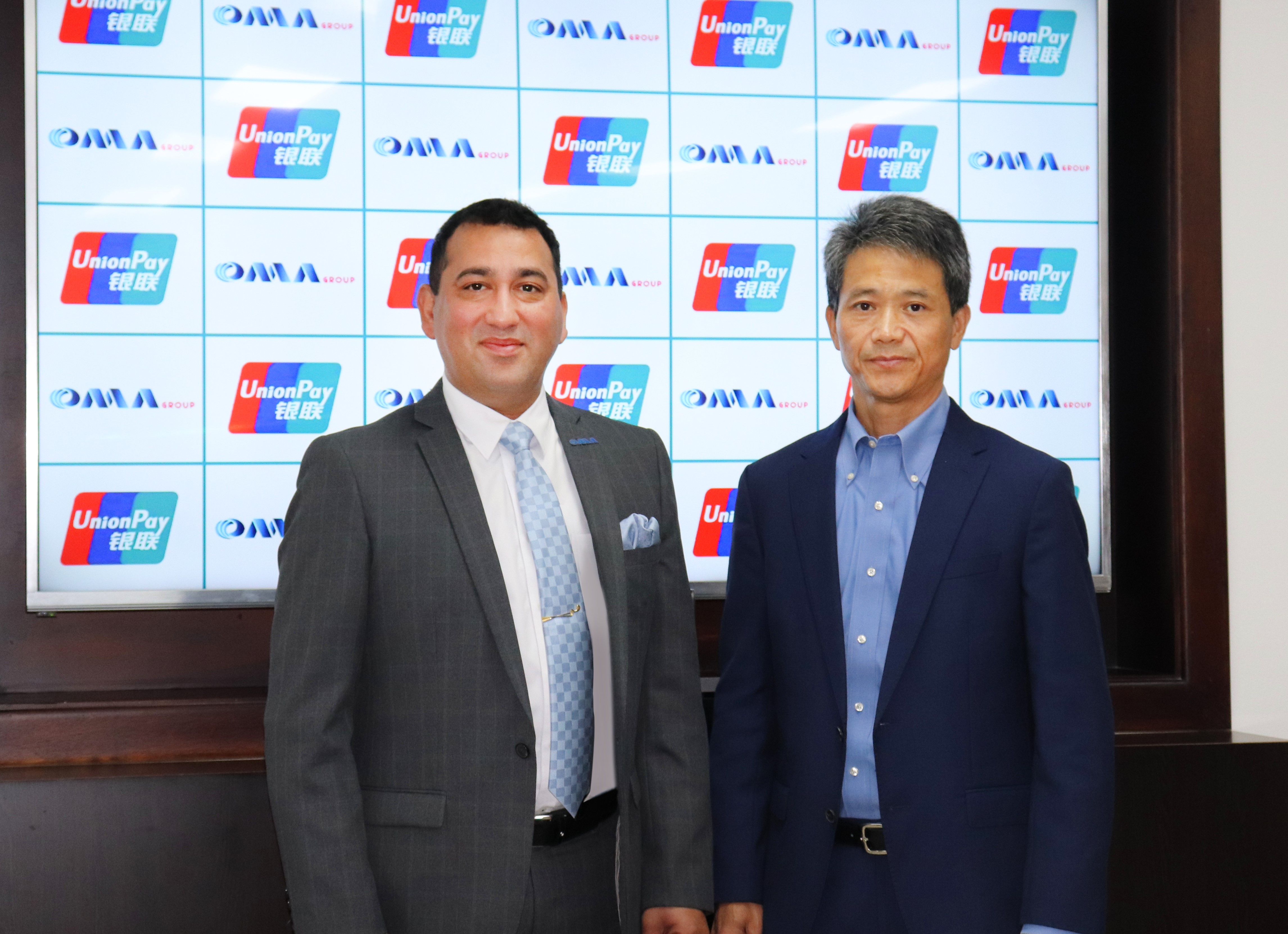 Niranj Sangal, Group CEO of OMA Emirates Group LLC with James Yang, General Manager Middle East of UnionPay International