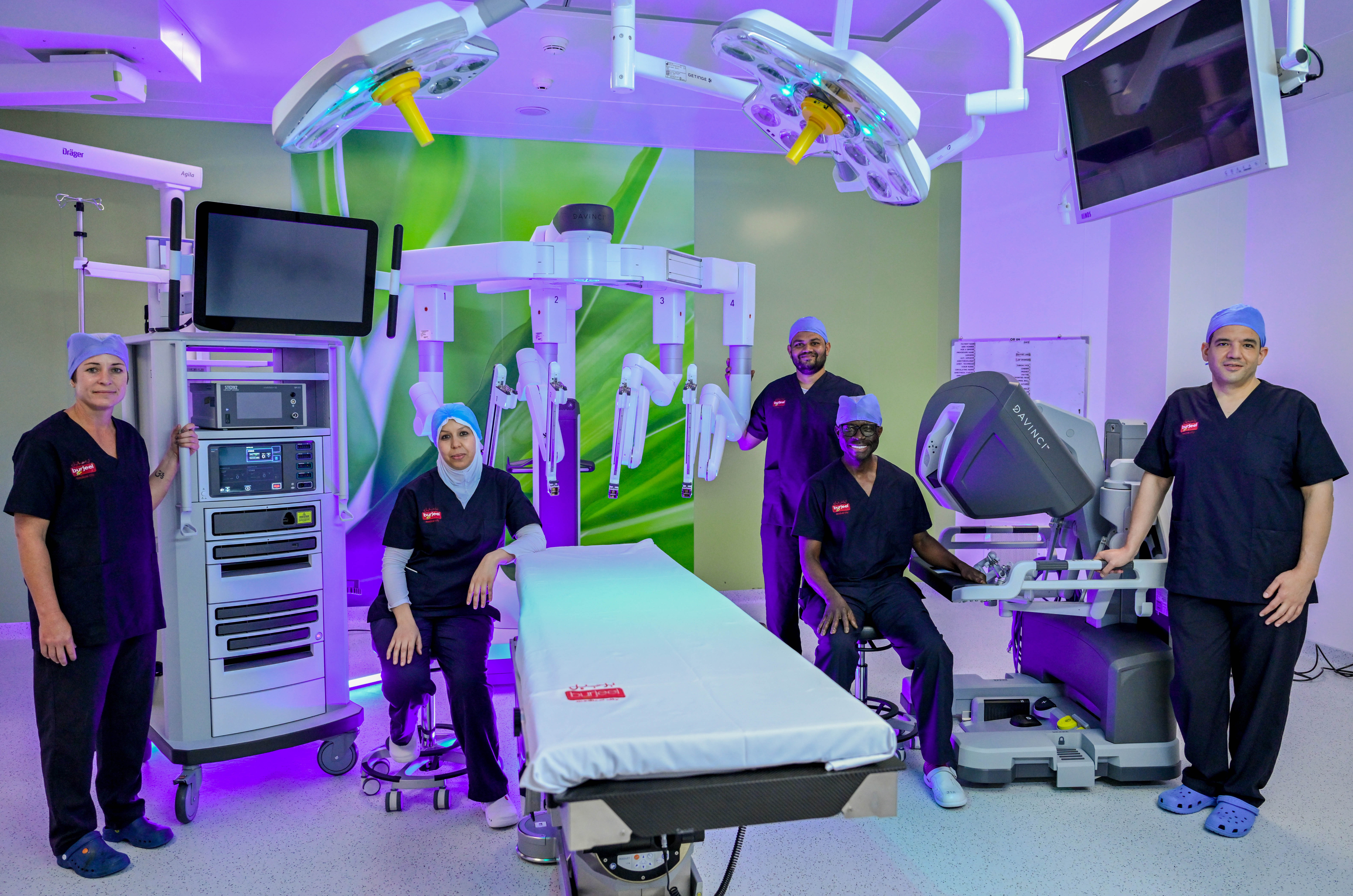 Dr. Jafaru Abu (second from right), Director of Robotic Surgery at BMC, and the medical team near da Vinci Xi robotic system. (2)