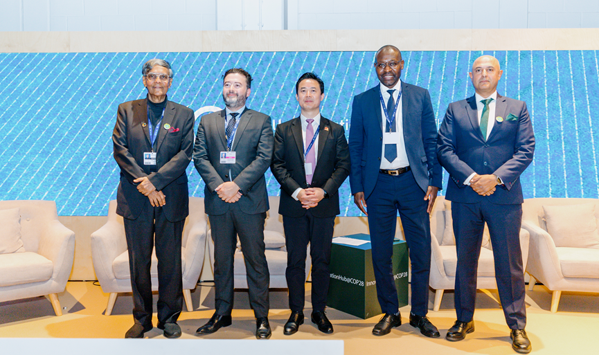Speakers pose for a photo following the UNFCCC UGIH session