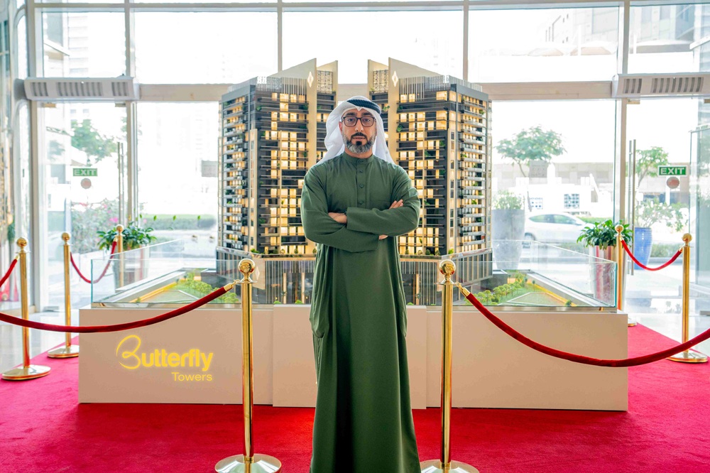 Marwan-Al-Sayyah-CEO-of-Al-Sayyah-Group-showcasing-a-model-of-the-Butterfly-Towers.jpg