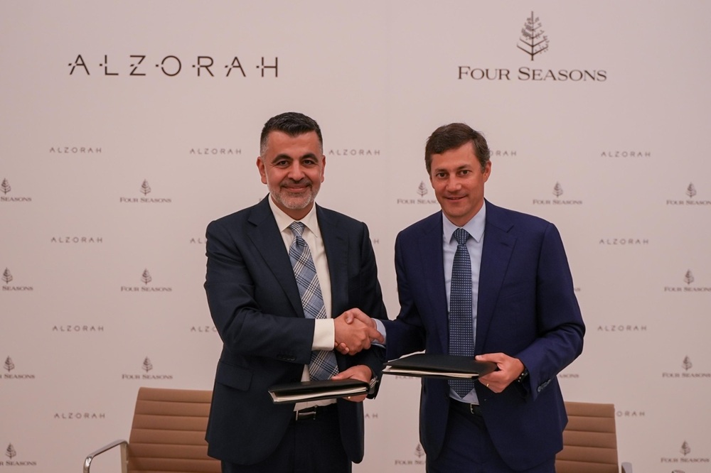 From-left-George-Saad-CEO-of-Al-Zorah-Development-Company-and-Adrian-Messerli-Area-President-Hotel-Operations-EMEA-at-Four-Seasons-during-the-signing-of-the-agreement.jpg