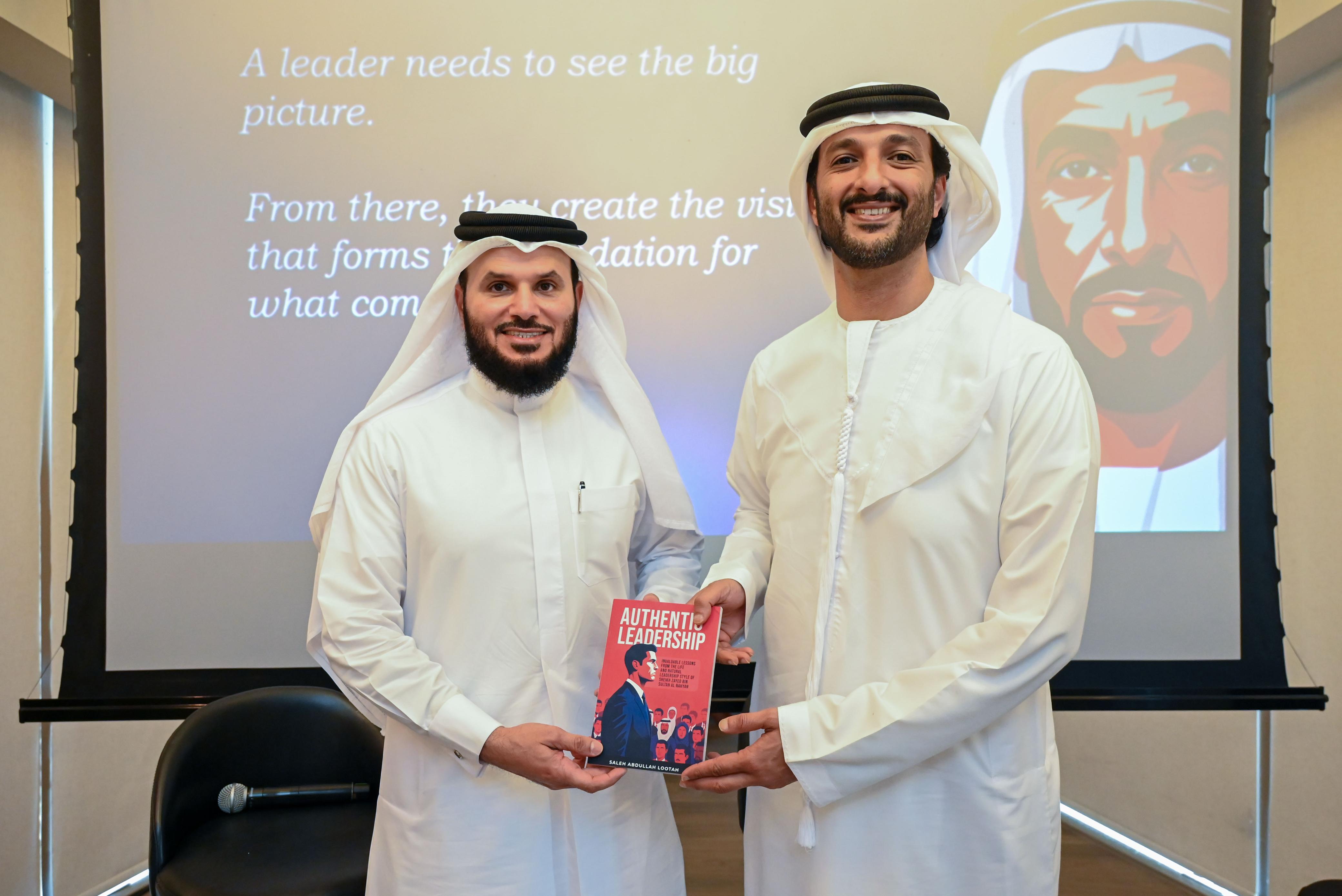 Emirati business leader and Lootah Holding Chairman Saleh Abdullah Lootah presents his book to His Excellency Abdulla bin Touq Al Marri, UAE Minister of Economy and Tourism